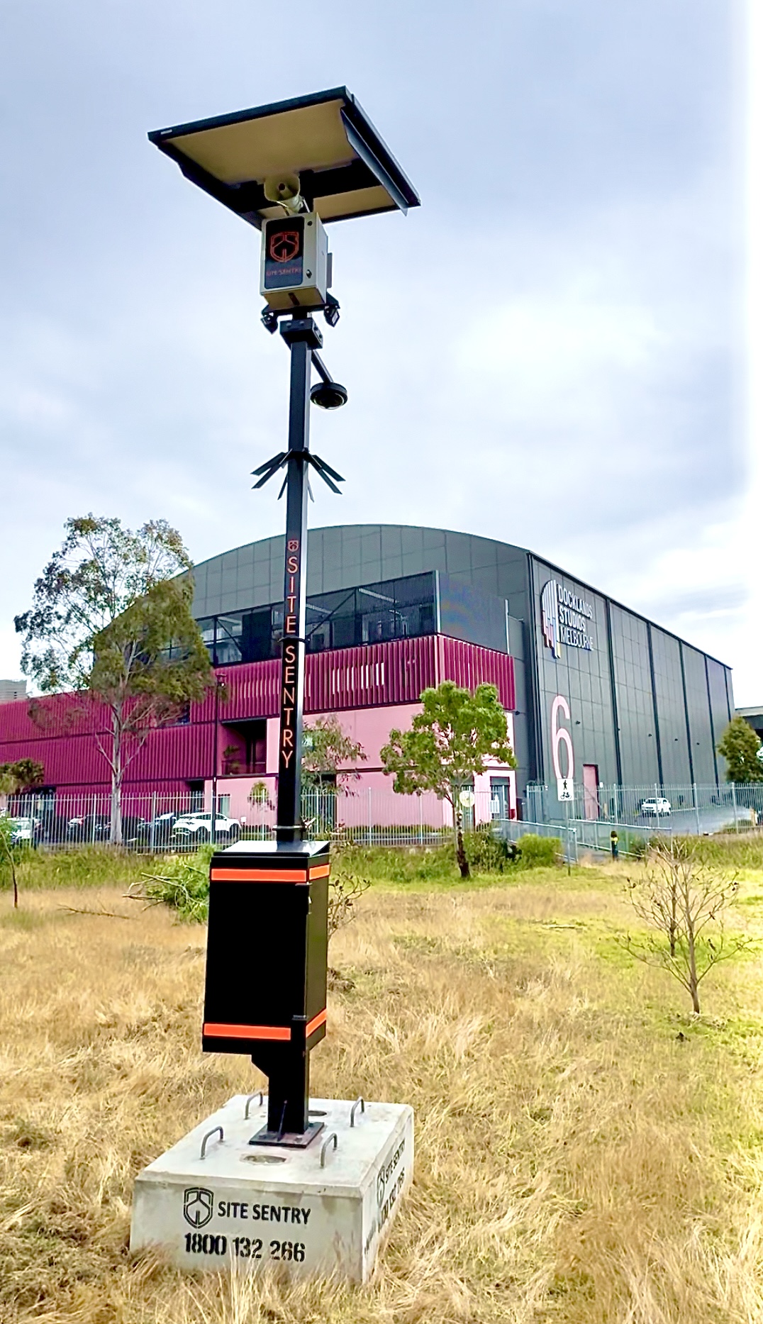 Docklands Studio Melbourne, VIC: Site Sentry security system with camera and solar panel. Building number 6 is visible in the background.